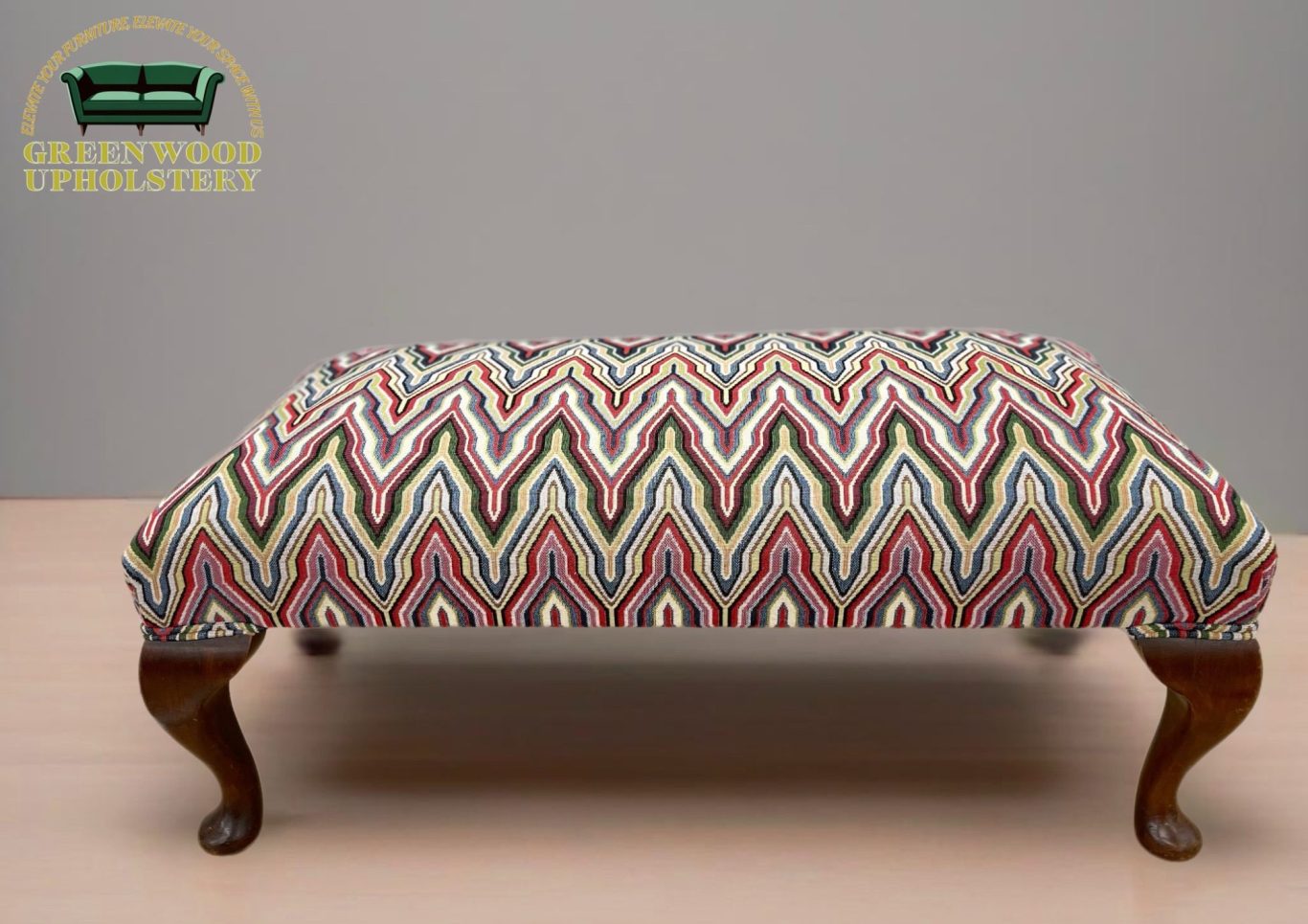 Colorful zigzag-patterned ottoman, student work from Greenwood Upholstery workshop in Mytholmroyd, Calder Valley.

